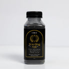 Warding Salt ritual protection blend with black salt, rosemary, and activated charcoal in an 8 oz jar from Circe Boutique.