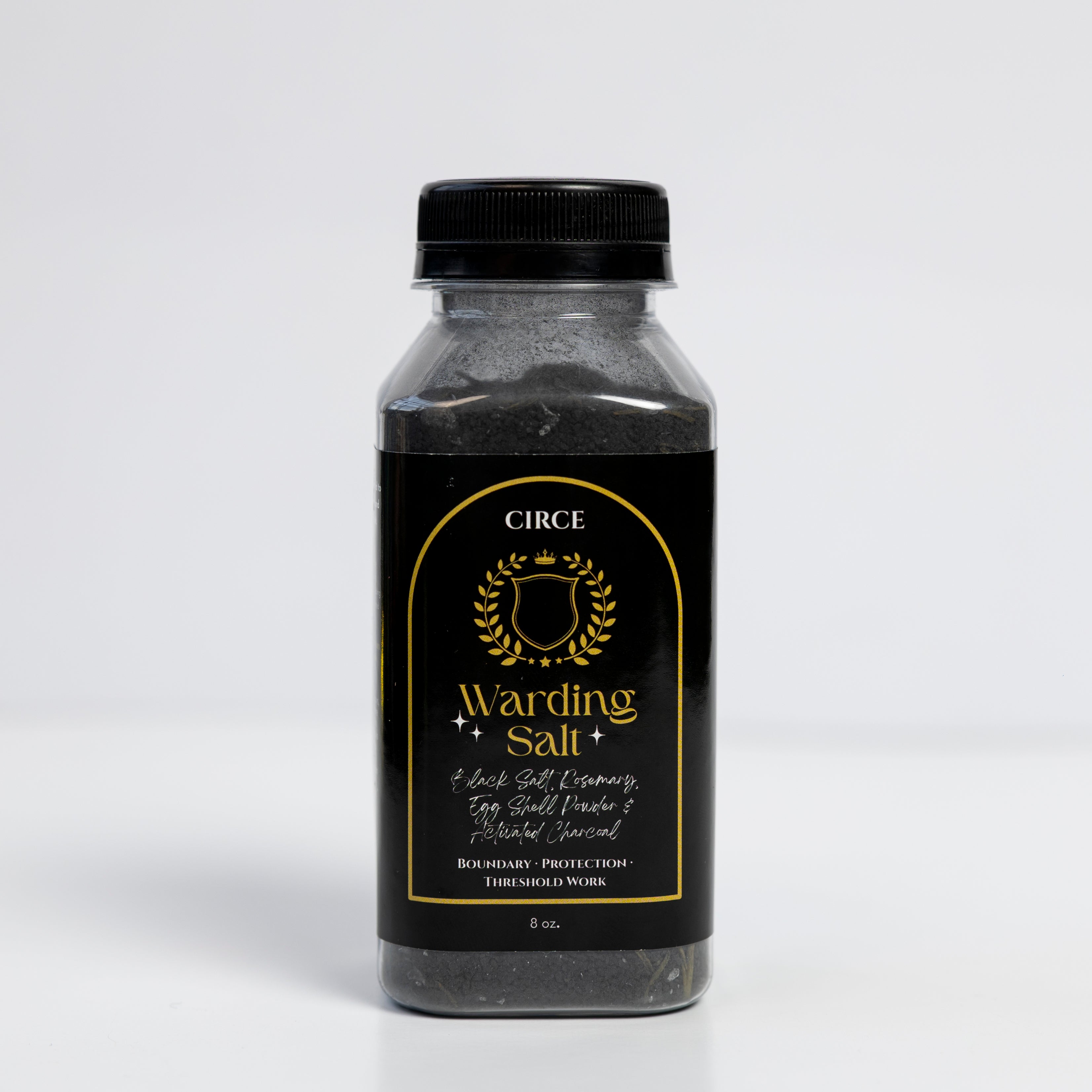 Warding Salt ritual protection blend with black salt, rosemary, and activated charcoal in an 8 oz jar from Circe Boutique.