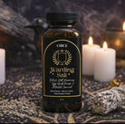 Warding Salt Ritual Protection Blend with black salt, rosemary, and activated charcoal in an 8 oz jar from Circe Boutique.
