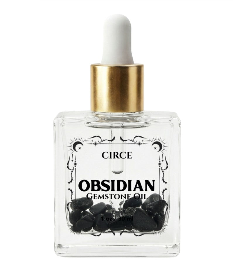 Protection Body Oil with obsidian crystal from Circe Boutique, showcasing a dark, luxurious ritual oil in a glass bottle.