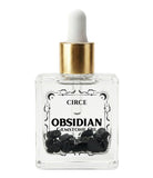 Protection Body Oil with obsidian crystal from Circe Boutique, showcasing a dark, luxurious ritual oil in a glass bottle.