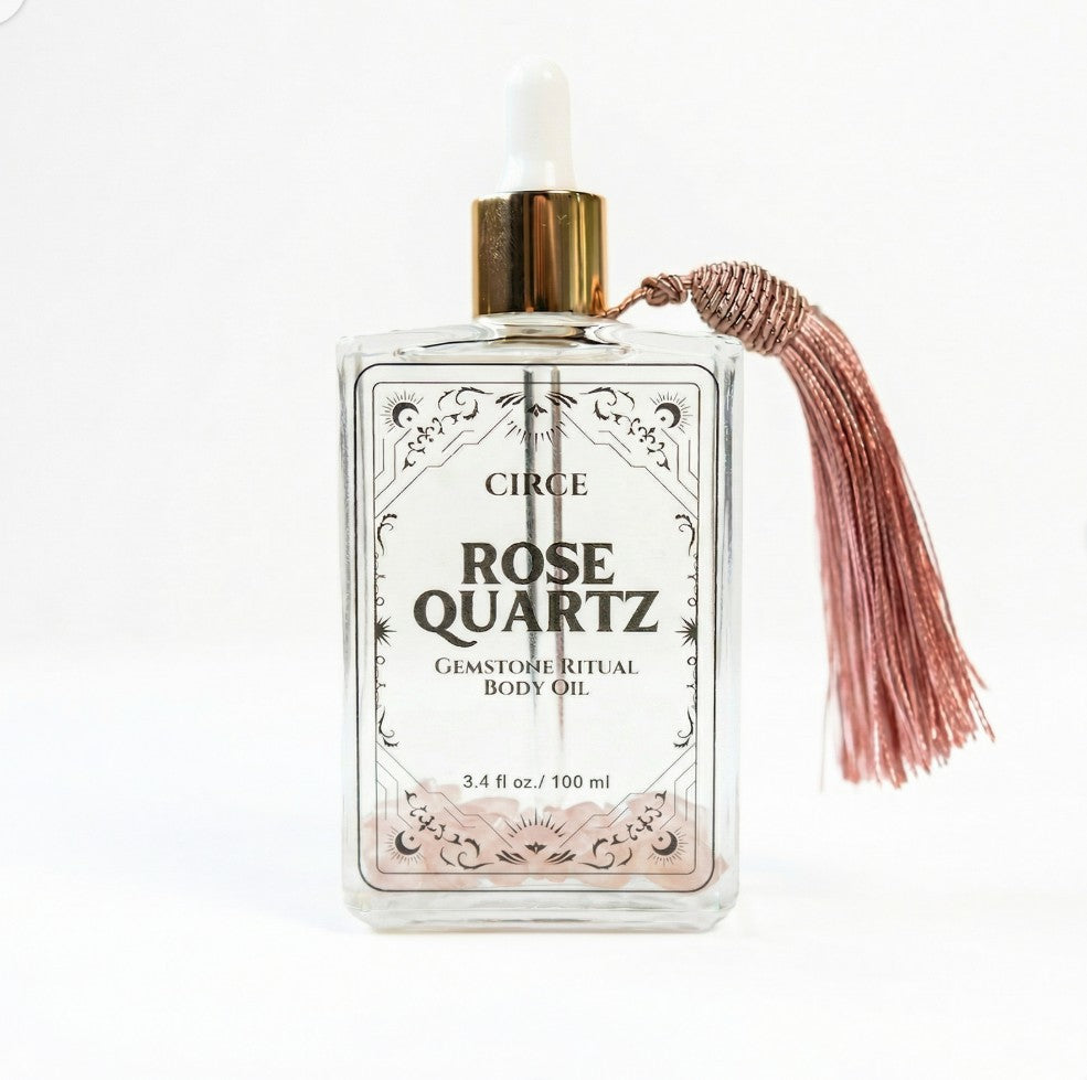 Rose Quartz Body Oil by Circe Boutique, 3.4 oz bottle with rose quartz crystal, promoting self-love and glowing skin.