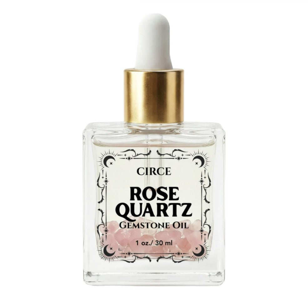Rose quartz gemstone body oil by Circe Boutique in a 3.4 oz bottle, designed for self-love and glowing skin.
