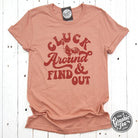 Heather Sunset short sleeve graphic tee by The Graphic Tee featuring a playful "Cluck Around and Find Out" chicken design.