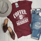 Unisex V-neck graphic T-shirt from The Graphic Tee with "Coffee Makes Me Feel Less Murdery" design, casual and comfortable fit.