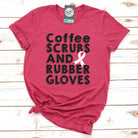 Unisex SS graphic tee featuring coffee, scrubs, and rubber gloves design by The Graphic Tee. Casual, stylish apparel.