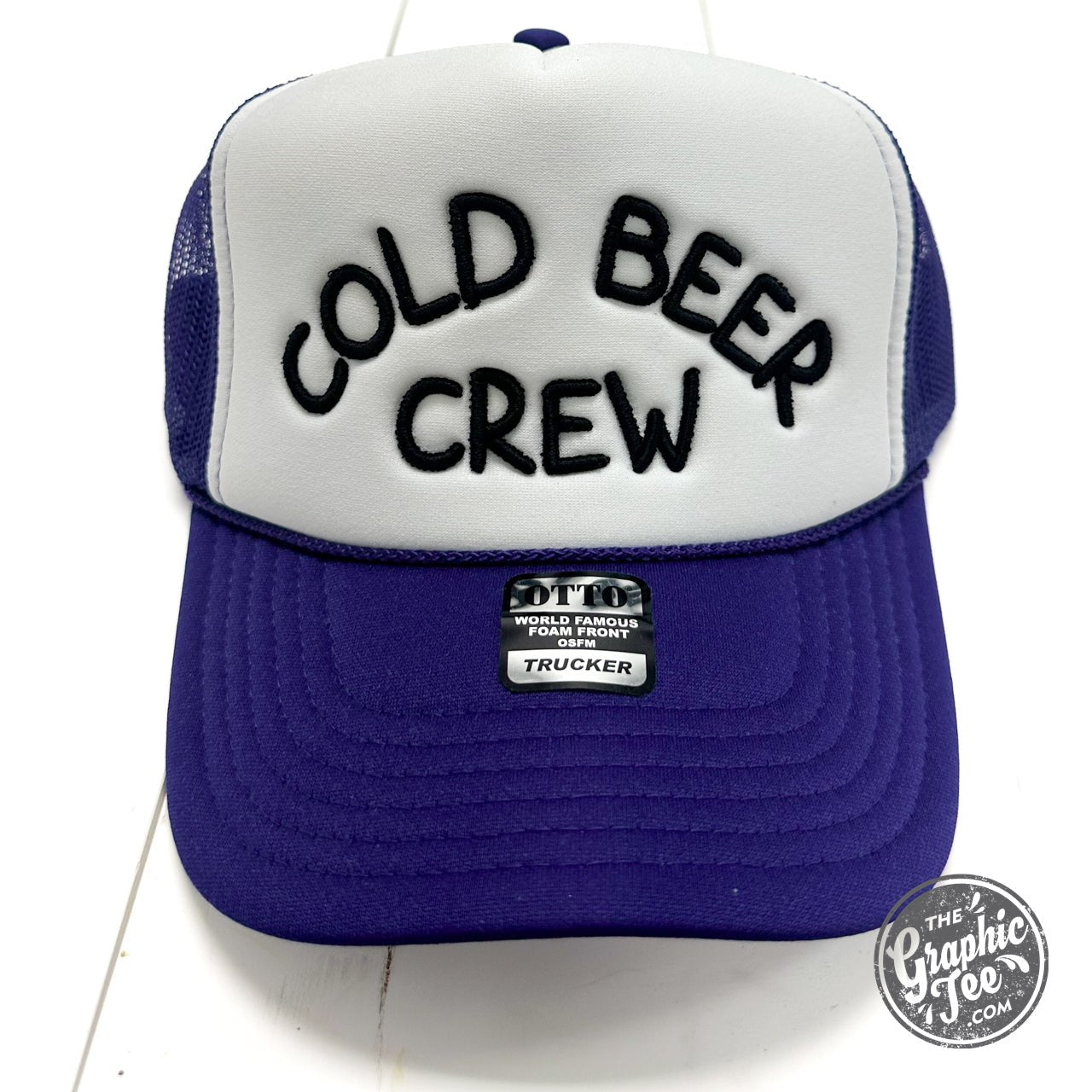 Foam trucker cap featuring "Cold Beer Crew" logo in bold lettering, made by The Graphic Tee, with mesh back and curved brim.