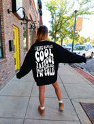 Gray crewneck sweatshirt featuring "I Have Really Cool Tattoos, But I'm Cold" printed design, casual and comfortable for everyday wear.