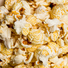 Dill pickle flavored popcorn in a 2 oz bag by Colorado Popcorn Company, showing the colorful packaging and popcorn inside.