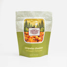 Spicy jalapeño cheddar popcorn from Colorado Popcorn Company in a 2 oz bag, featuring bright orange popcorn with green jalapeño pieces.