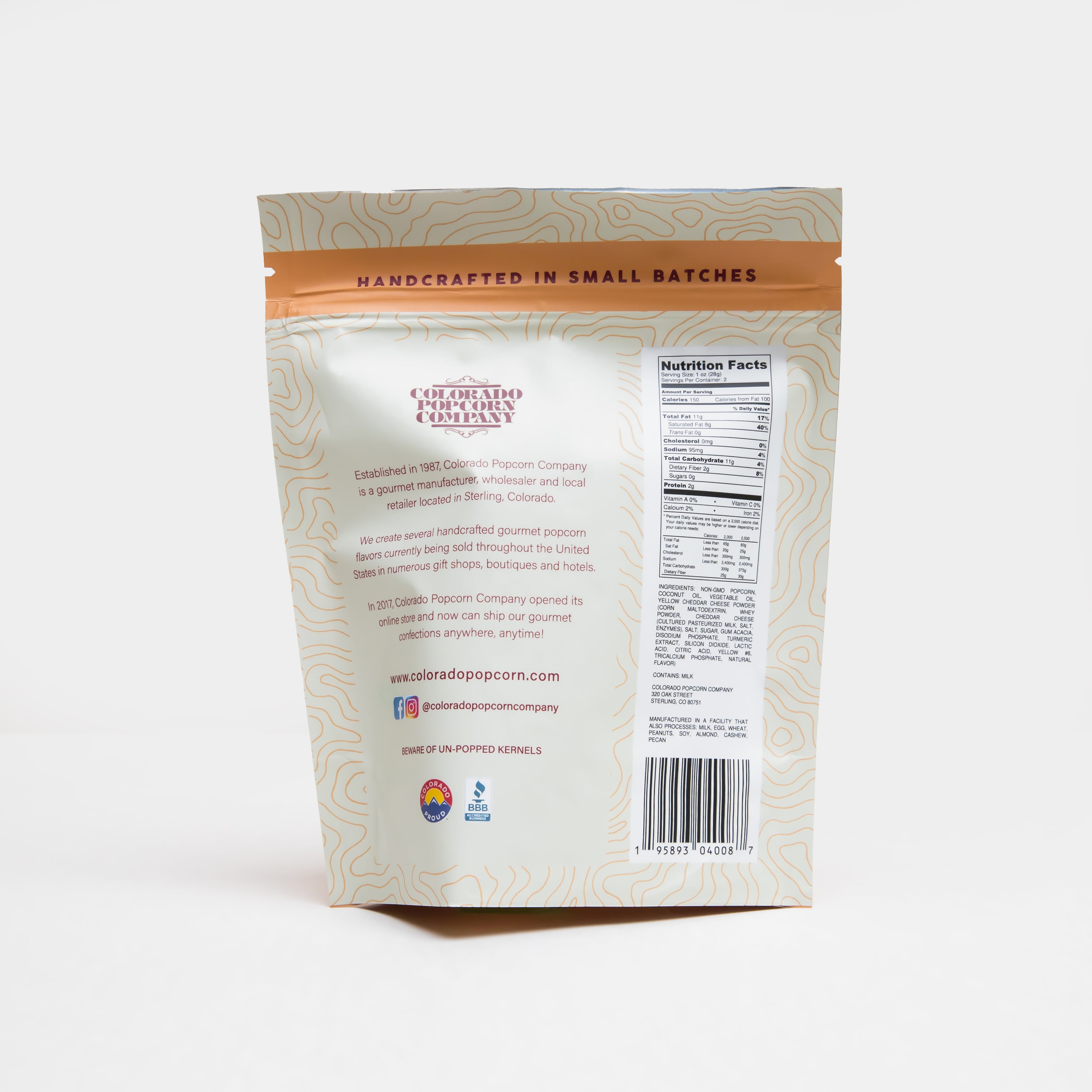 Yellow cheddar popcorn by Colorado Popcorn Company in a clear bag, showcasing bright yellow cheese-coated kernels.