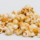Amaretto flavored popcorn in a 5 oz bag from Colorado Popcorn Company, showcasing glossy, caramelized popcorn with a sweet glaze.
