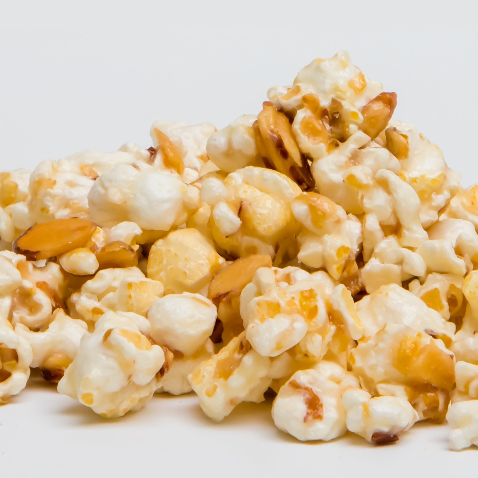 Amaretto flavored popcorn in a 5 oz bag from Colorado Popcorn Company, showcasing glossy, caramelized popcorn with a sweet glaze.