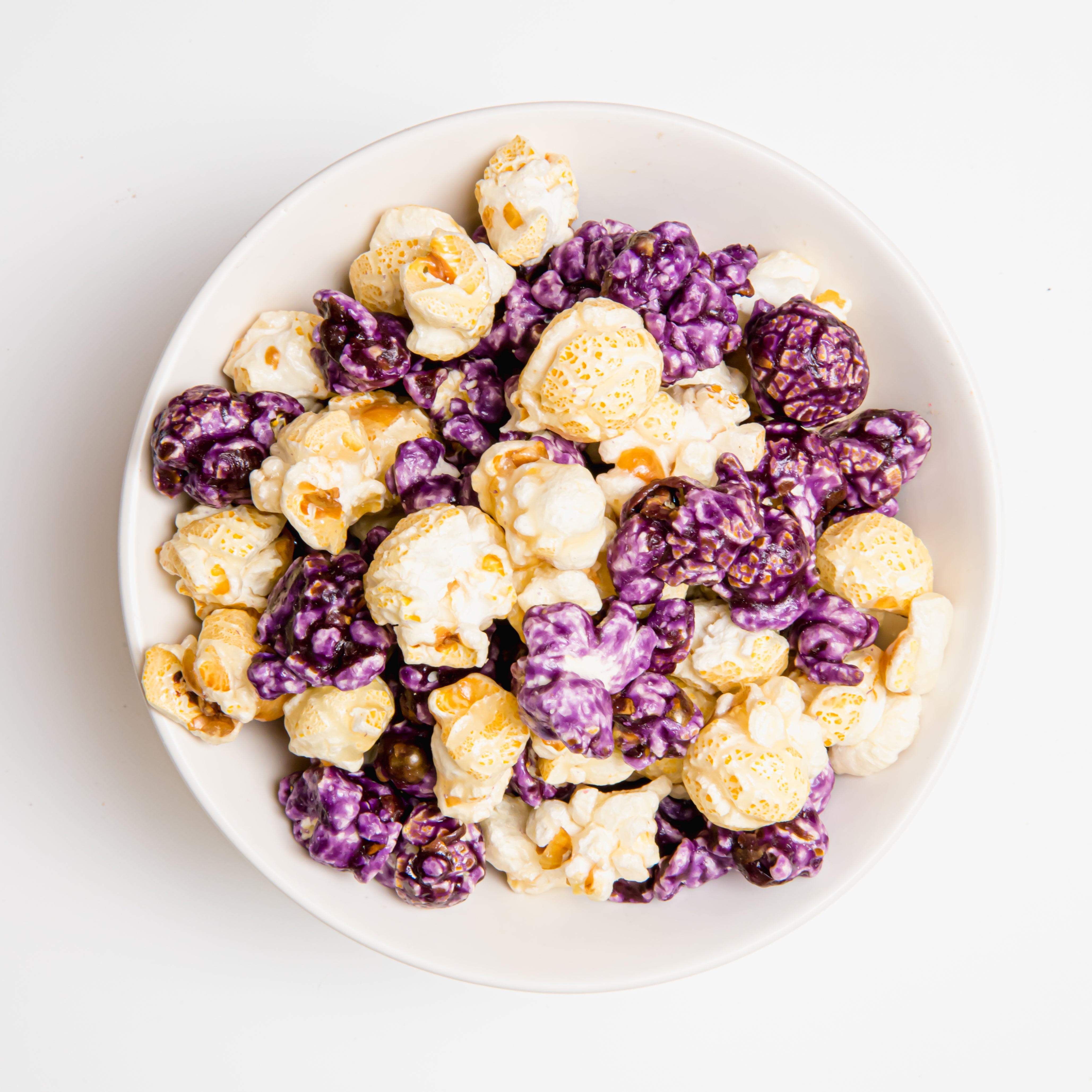 Blueberry cheesecake popcorn from Colorado Popcorn Company in a 5 oz bag with vibrant blueberry and cheesecake flavor details.