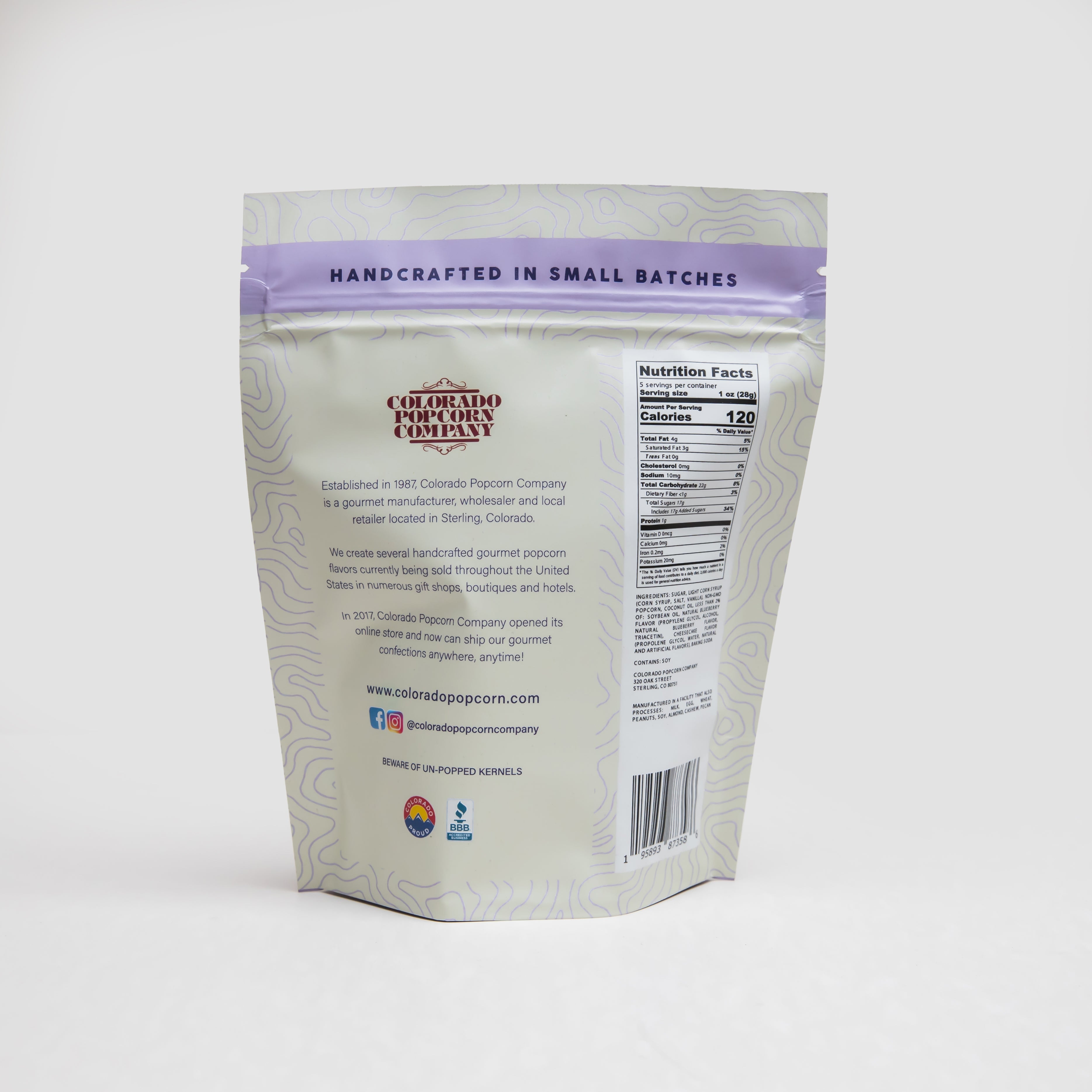 Blueberry cheesecake popcorn from Colorado Popcorn Company in a 5 oz bag, showing a bowl of blueberry cheesecake flavored popcorn.