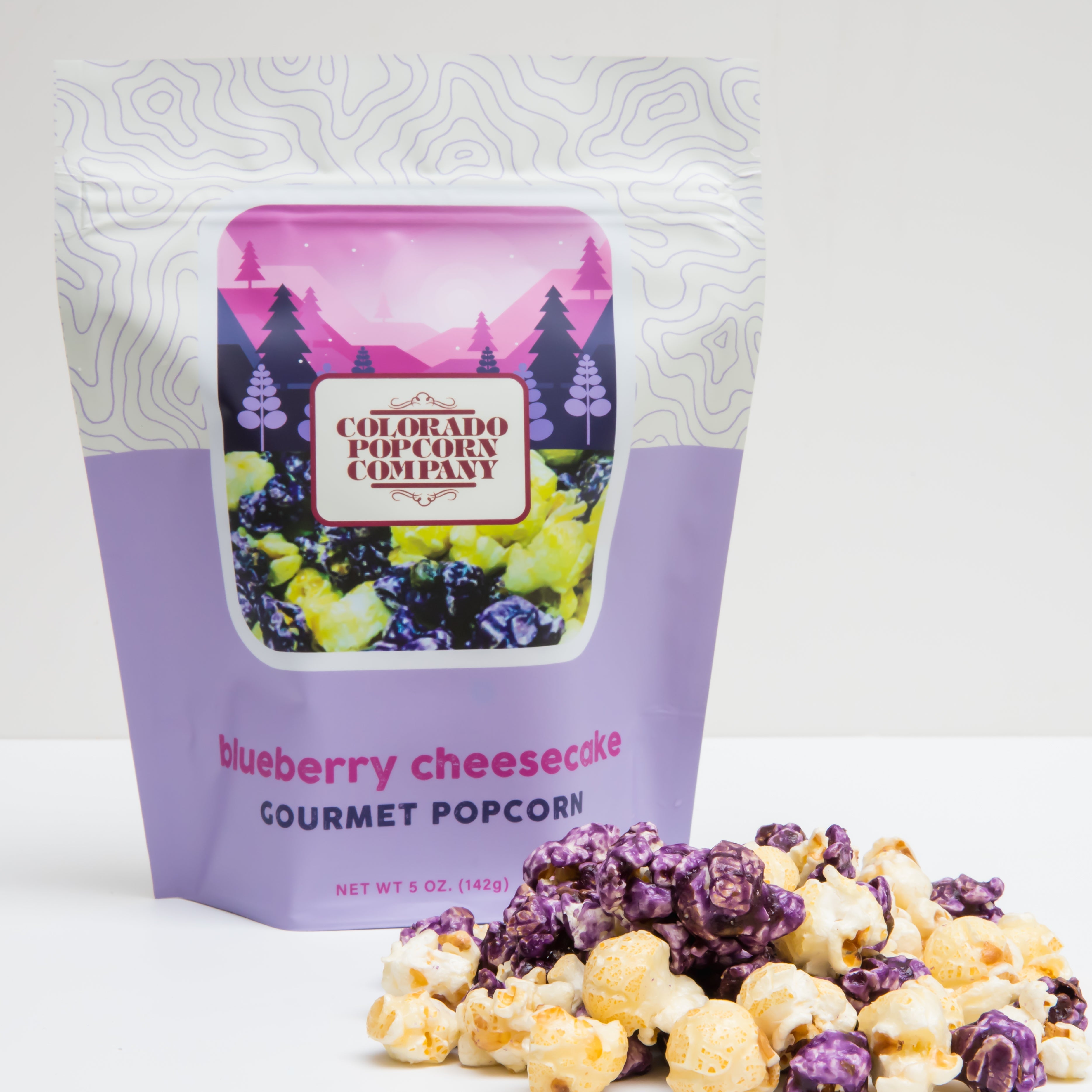 Blueberry cheesecake flavored popcorn from Colorado Popcorn Company in a 5 oz bag with blue and purple packaging.