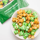 Colorado Popcorn Company caramel apple popcorn in a 5 oz bag, showing golden caramel-coated popcorn with apple flavor details.