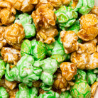 Caramel apple popcorn in a clear bag from Colorado Popcorn Company, featuring golden caramel-coated popcorn with apple flavor.