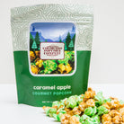 Sweet caramel apple popcorn from Colorado Popcorn Company in a 5 oz bag, featuring caramel-coated popcorn with apple flavor.