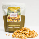 Caramel peanut popcorn from Colorado Popcorn Company in a 5 oz bag, showcasing golden caramel coating and roasted peanuts.