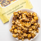 Chocolate English toffee popcorn by Colorado Popcorn Company in a 5 oz bag, featuring glossy toffee-coated popcorn pieces.