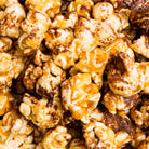 Chocolate English toffee popcorn by Colorado Popcorn Company in a 5 oz bag, featuring crunchy toffee-coated popcorn pieces.
