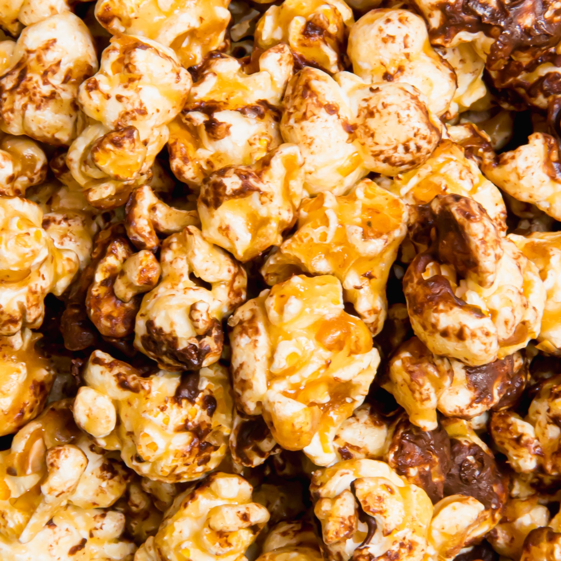 Chocolate English toffee popcorn by Colorado Popcorn Company in a 5 oz bag, featuring crunchy toffee-coated popcorn pieces.