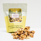 Crunchy chocolate English toffee popcorn from Colorado Popcorn Company in a 5 oz bag with caramelized toffee coating.