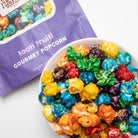 Colorado Popcorn Company Tooti Fruiti Popcorn in a 5 oz bag with colorful fruit-flavored popcorn pieces.