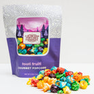 Colorado Popcorn Company Tooti Fruiti Popcorn in a 5 oz bag with colorful fruit-flavored popcorn pieces.