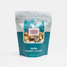 Turtle popcorn from Colorado Popcorn Company in a 5 oz bag, featuring caramel, chocolate, and pecan coated popcorn.