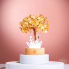 Golden Lamp of Wealth night light featuring a citrine tree by Conscious Items, glowing warmly with intricate design details.