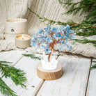 Guardian Angel Night Light with Aquamarine Tree, a protective lamp by Conscious Items, glowing softly with calming blue tones.