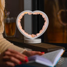 Rose quartz heart-shaped night light from Conscious Items, featuring a Love Magnet design, ideal for ambient bedroom lighting.