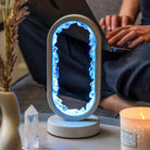 Clear quartz night light by Conscious Items, Manifest Success lamp of achievement with glowing, polished crystal design.