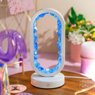 Clear Quartz Lamp of Achievement night light by Conscious Items, featuring a sleek design and glowing clear quartz for success.