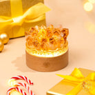 Conscious Items Midas Citrine Night Light titled "Turn My Life to Gold," featuring a warm, glowing citrine-inspired lamp on a wooden surface.