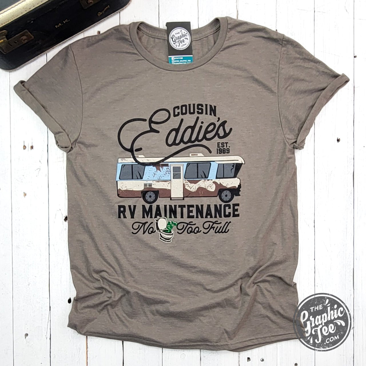 Cousin Eddie's RV Maintenance short sleeve graphic tee by The Graphic Tee, featuring a fun RV repair design on a casual T-shirt.