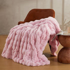 Pink faux fur throw blanket by CozyNest Decor, fuzzy plush, cozy and thick king size bed blanket for warmth and comfort.
