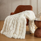 White Faux Fur Throw Blanket by CozyNest Decor, plush and cozy bed blanket, thick and warm for queen-sized beds.