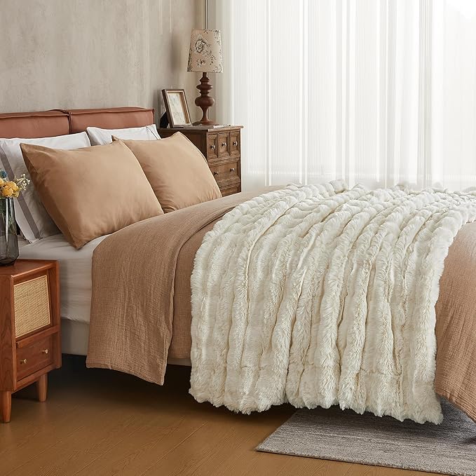 White faux fur throw blanket by CozyNest Decor, plush and cozy, perfect for a queen-sized bed, thick and warm for comfort