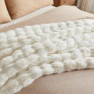 White faux fur throw blanket from CozyNest Decor, plush cozy bed blanket, thick and warm for queen-sized beds