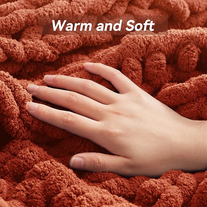 CozyNest Decor chunky knit throw blanket in vibrant orange, handmade, machine washable, perfect for bed or couch decor.