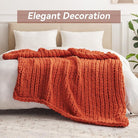 CozyNest Decor chunky knit throw blanket in orange, handmade, 60x80 inches, soft chenille yarn, perfect for bed or couch decor.