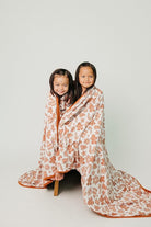 CozyNest Decor Copper Pearl Jumbo Knit 3-Layer Stretchy Throw Blanket in gingerbread color, featuring soft, textured knit fabric.