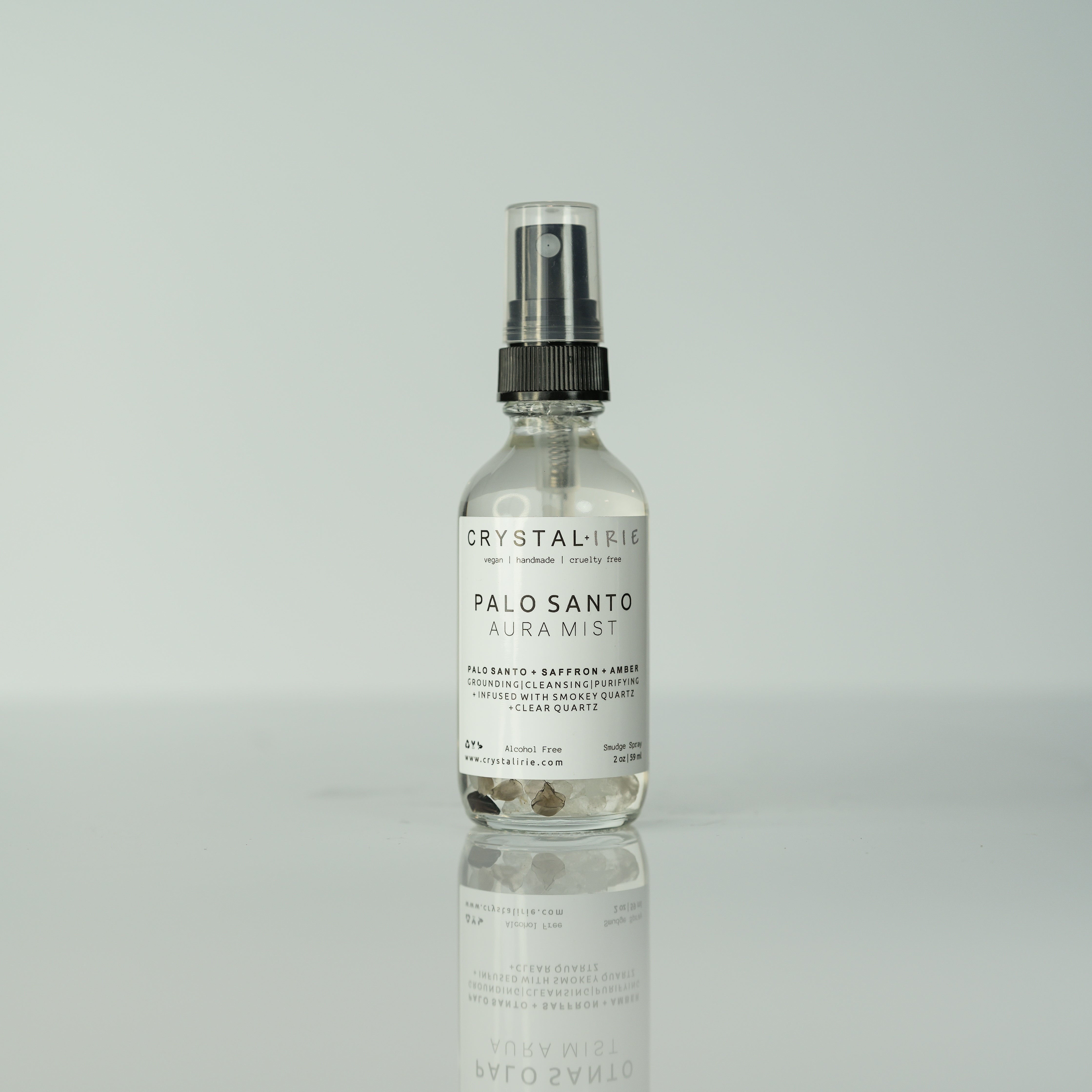 Crystal Irie Palo Santo Aura Spray bottle with natural wooden cap, designed for spiritual and aromatic use.