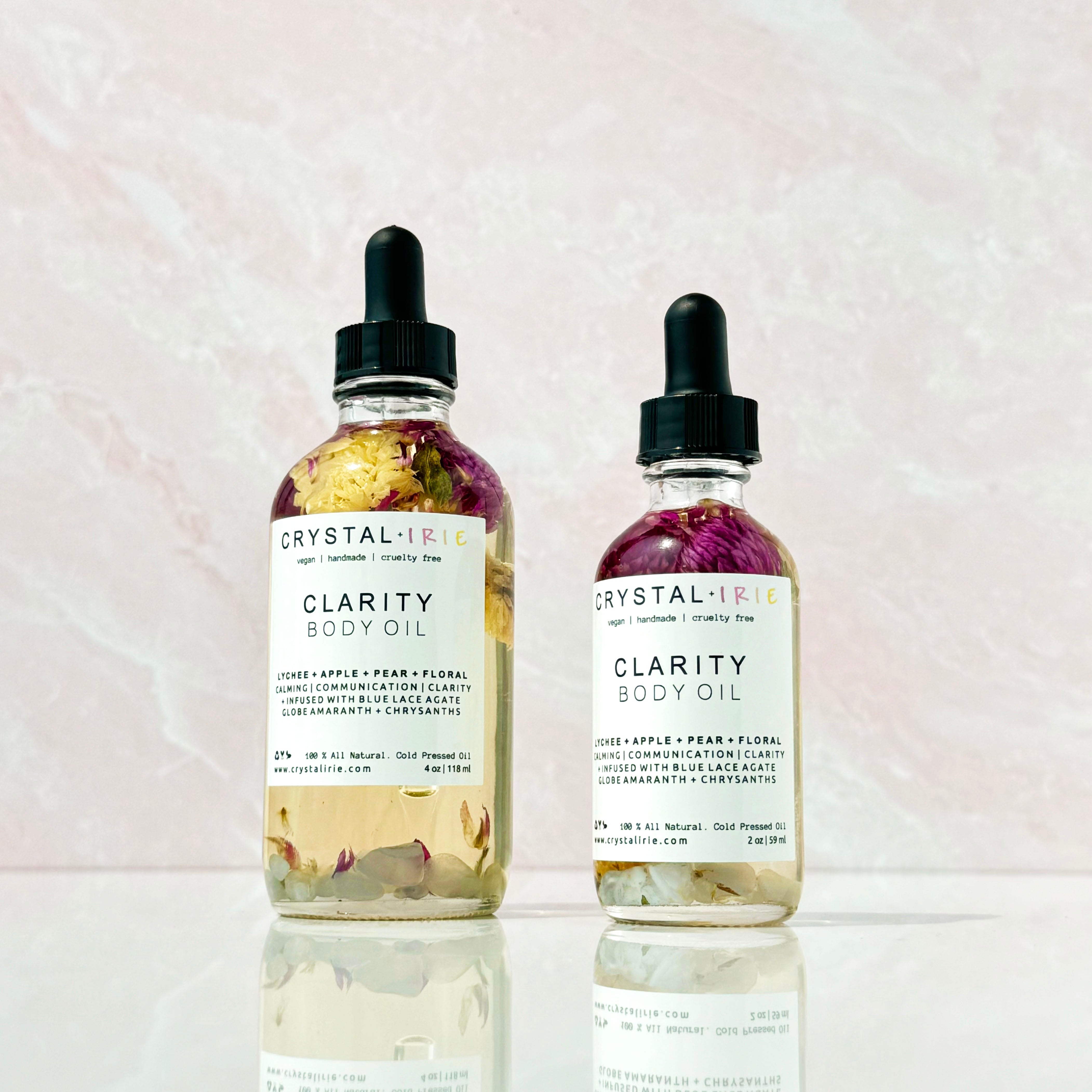 Crystal Irie Clarity Body Oil bottle with a dropper cap, showcasing clear, lightweight body oil in a sleek container.