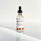 Crystal Irie Dragon's Blood Body Oil in a 2oz bottle, showcasing the vibrant red oil in a clear glass container.