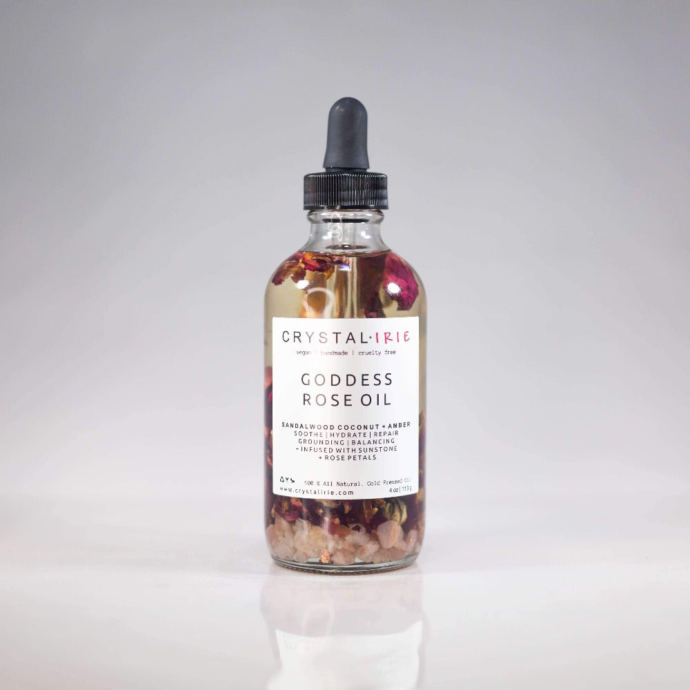 Crystal Irie Goddess Rose Oil body oil bottle with rose design, showcasing the luxurious, floral-infused skincare product.