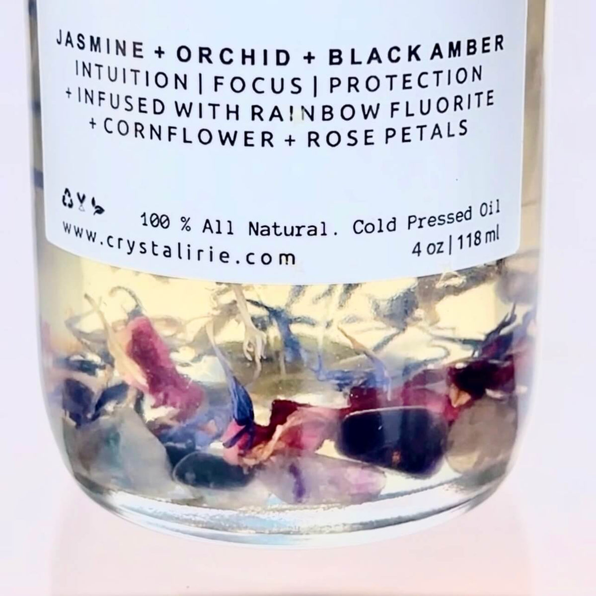 Crystal Irie pheromone body oil bottle with a sleek design, shown in a close-up image highlighting the product label.